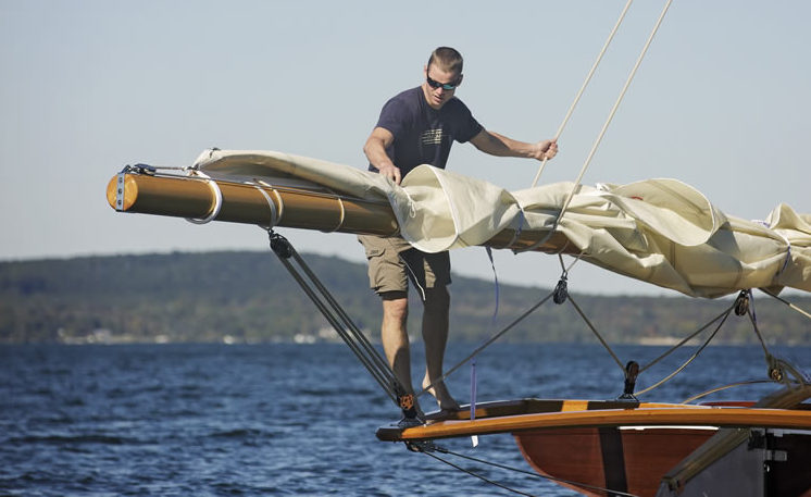 Ben Van Dam adjusting sails on Tattler II