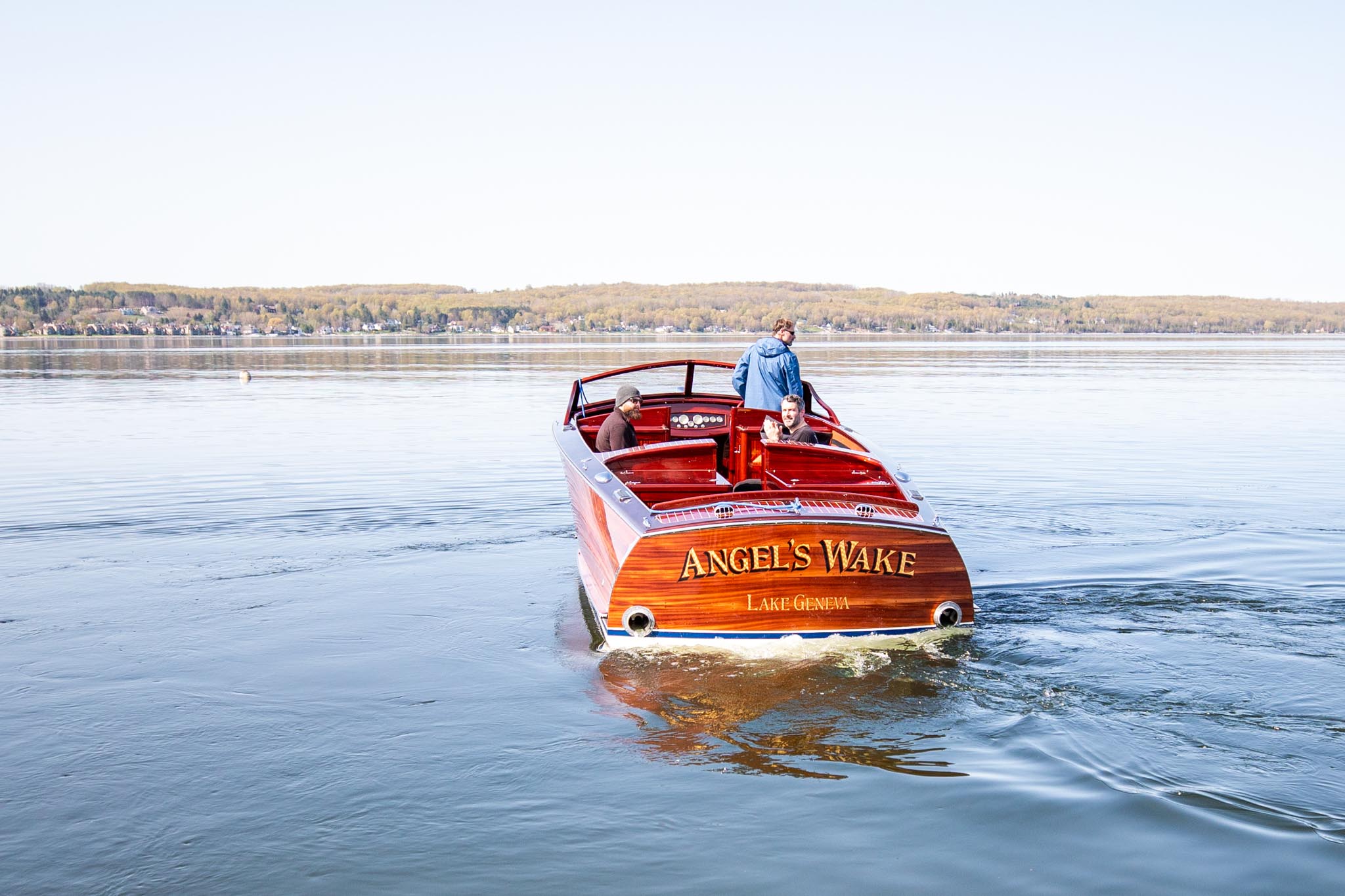 Craftsmen taking Angel's Wake for a ride on Lake Charlevoix